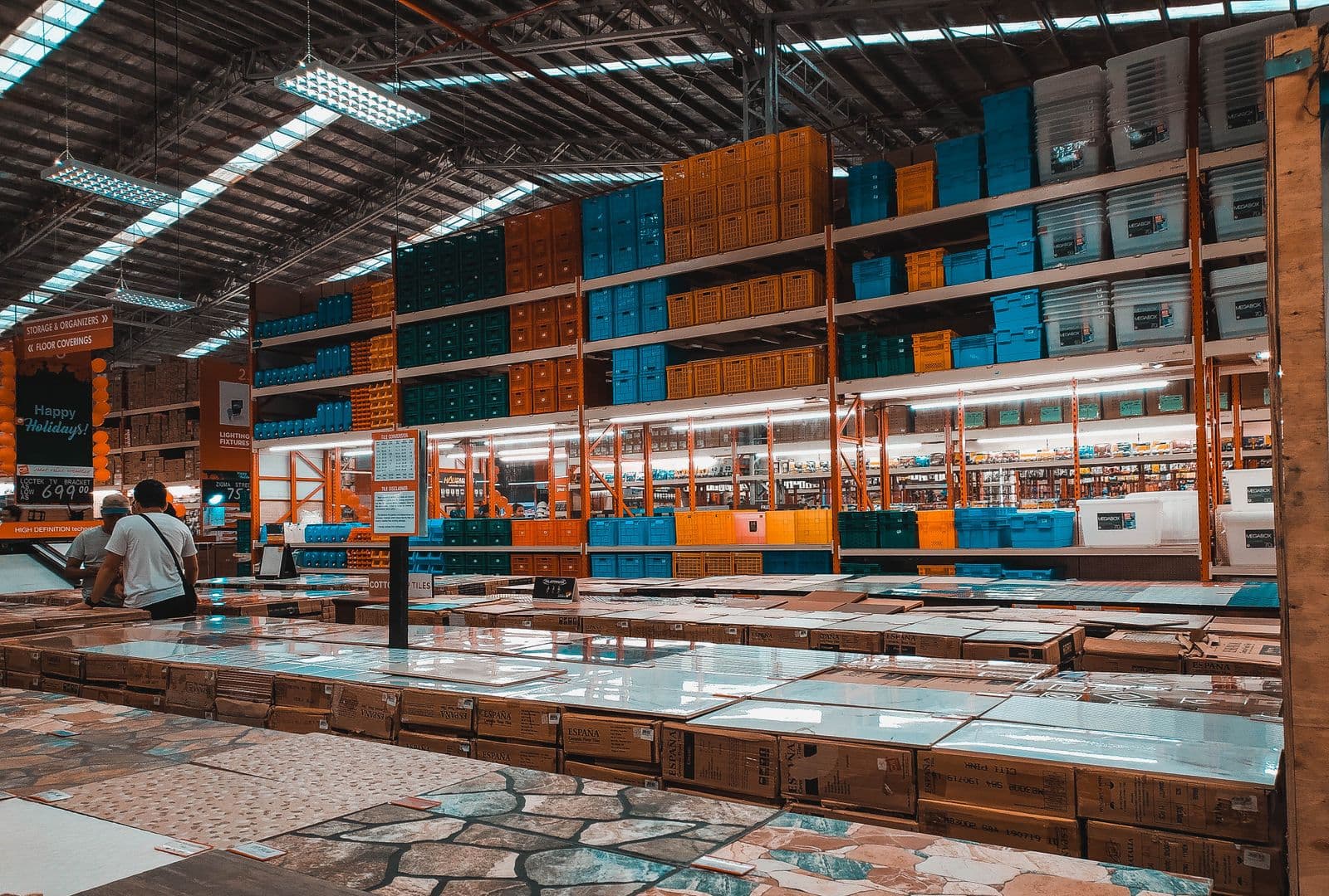 Warehouse aisle stocked with hardware, storage and building material