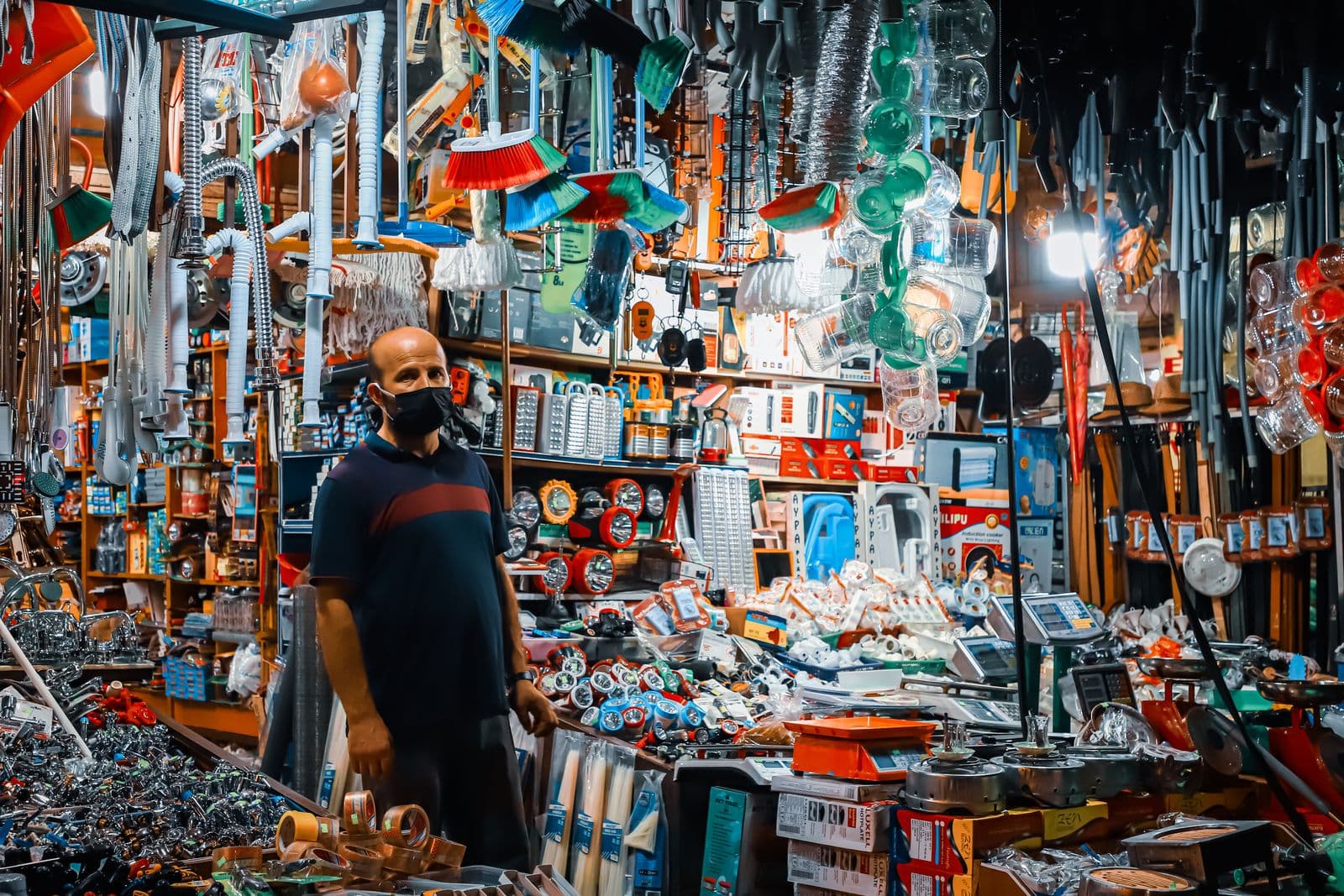 Inside a busy, fully stocked hardware shop